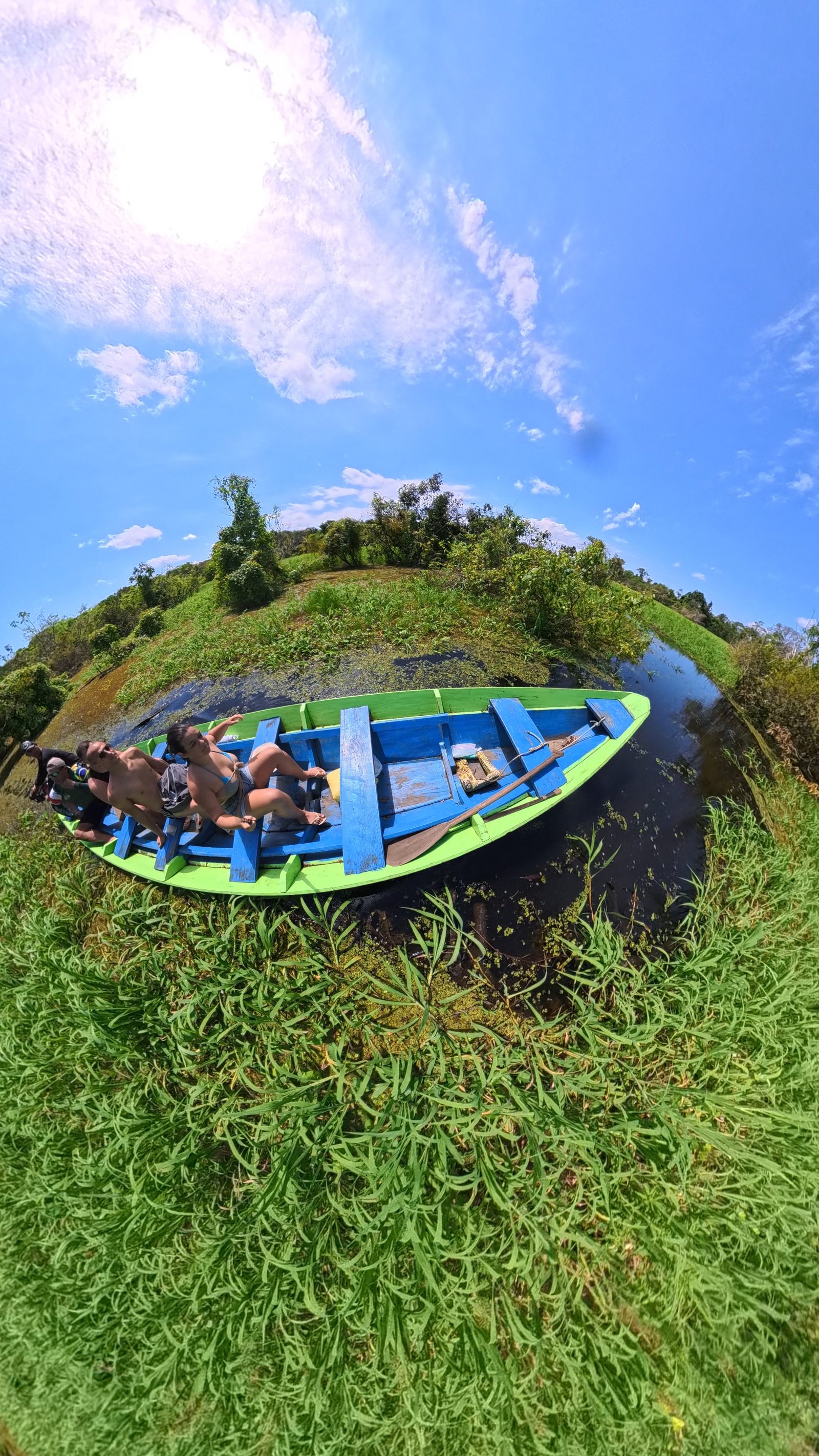 Canoe paddling through the flooded forest of the Amazon